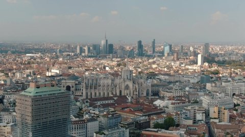 Aerial Drone Of Distant Milan Skyline and Milan Cathedral Duomo Di Milano At Sunset