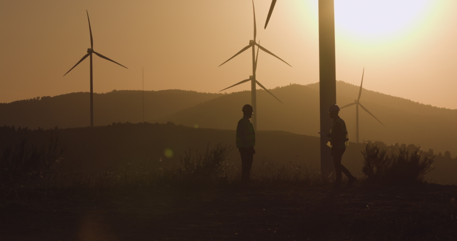 Two engineers made a deal at sunset, shaking hands Royalty-Free Stock Footage #1087091768