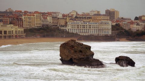 Biarritz, Nouvelle Aquitaine - France - December 3 2021: 

General views of Biarritz's beach in a beautiful cloudy day.