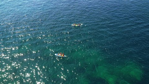 Alaior, Menorca - Spain - August 28 2021: People kayaking in Cala en Porter, Alaior.