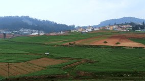 countryside rural farming field with mountain and flat sky background video taken at ooty tamilnadu india.