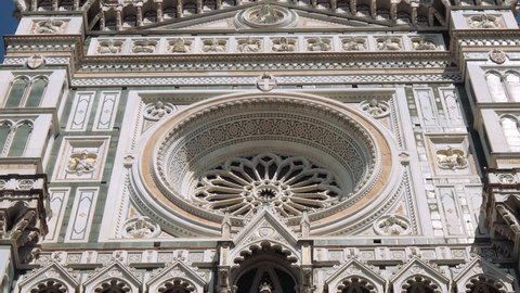 Tilt up of marble facade of Cathedral of Saint Mary of the Flower, Cattedrale di Santa Maria del Fiore, Florence, Italy