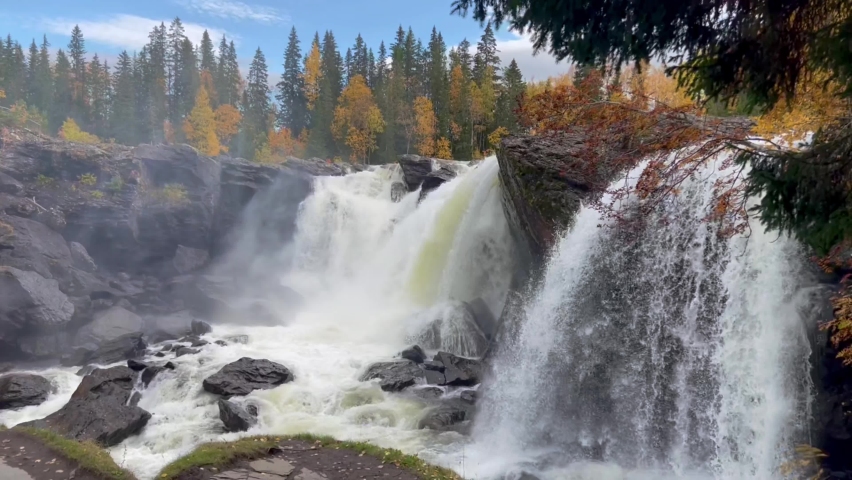 Beautiful waterfall in autumn forest