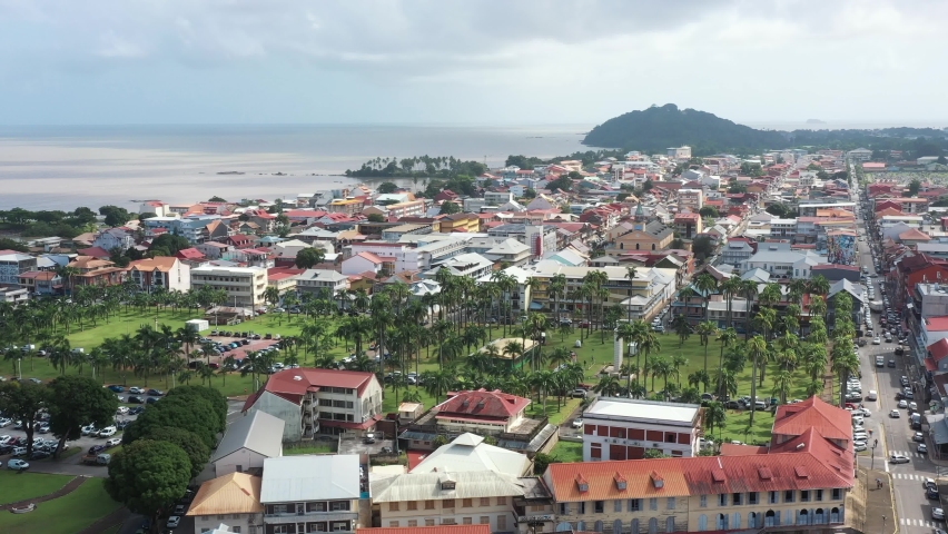 France, French Guiana, Cayenne, drone aerial view above the down town. Place des Palmistes square in foreground with palm trees. | Shutterstock HD Video #1087113563