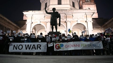 Milan, Italy - February 16, 2022: People hold banners during a pacifist #nowar flash mob to call for peace as tension rise between Russia and Ukraine