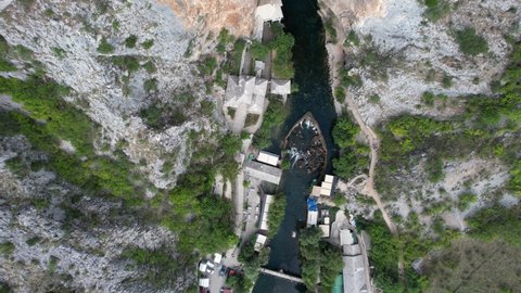 Drone view of the historical ottoman lodge built under the rock Blagaj City, dervish monastery built on the side of the river Buna