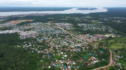 France, French Guiana, Saint Laurent du Maroni, drone aerial view above the city. Maroni river and Surinam country in back
