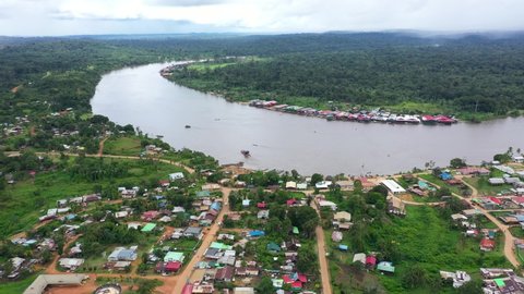 France, French Guiana, Maripasoula, wide drone aerial view above the old town. Maroni river and Surinam country in back