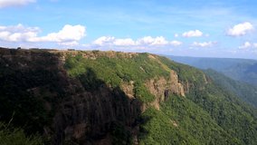 mountain range with bright blue sky at morning from flat angle video taken at seven sister waterfalls cherrapunji‎ meghalaya india.