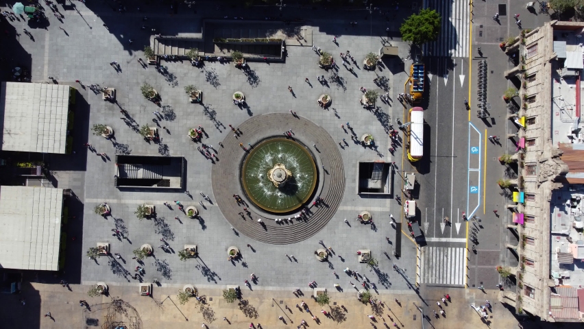 Classical fountain on the principal square in the center of Guadalajara city. Cenital plane footage.