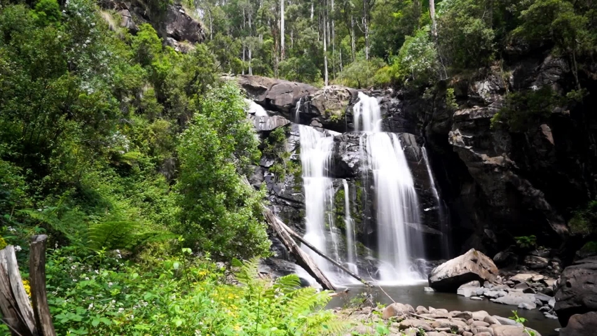 TIMELAPSE of stunning Australian waterfall in a national park (HD) | Shutterstock HD Video #1087124978