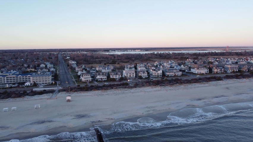 A beautiful aerial drone shot, flying towards beachfront houses in Cape May New Jersey, Cape May County.