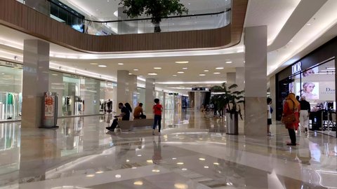 Surabaya, Indonesia - Feb 12 2022 : Ground Floor Pakuwon Mall 2 Surabaya city. A wide hall where we can walk sightseeing boutiques.