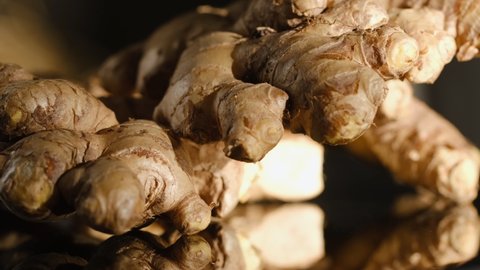 Whole ginger root on close up rotating 4K
