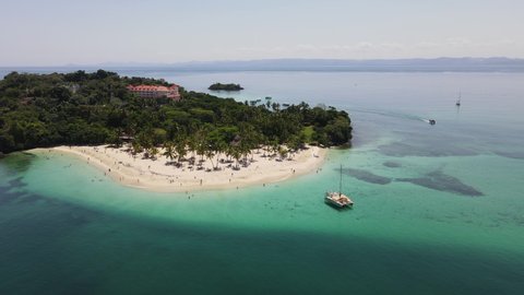 Bacardi Island or Samana, located on South from main island. Island is well known for it advertising of rum Bacardi. On the footage we see beautiful boats, water and white sand of the beach.