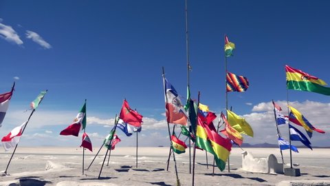 Waving flags of all countries participated in Dakar Rally in Salar de Uyuni, Bolivia