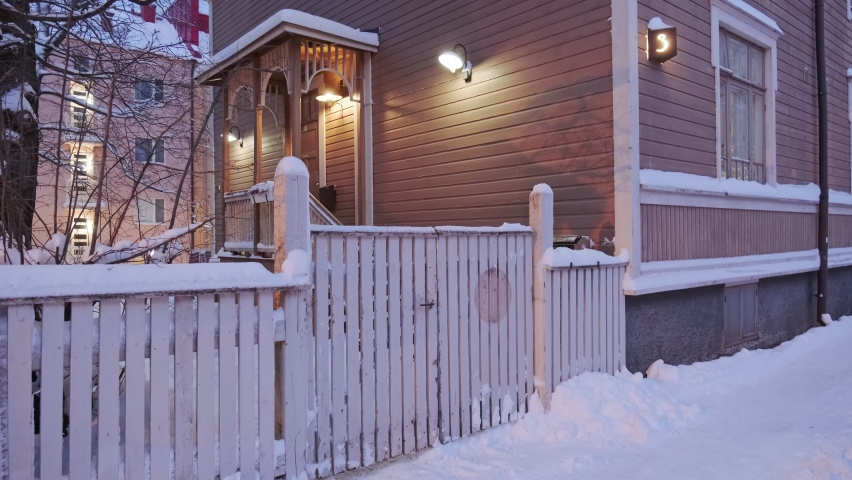 View of the Puu Vallila neighborhood in the snowy winter. It is the wooden houses old neighborhood in central Helsinki, Finland.