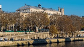 A Scenery of Paris With Fall Colosr and Peoples on the Seine Docks Historic Architecture