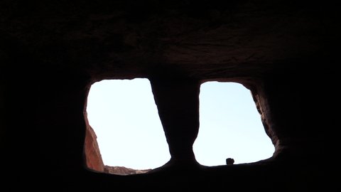 Petra UNESCO archeological world heritage, view from inside a temple monument cave rock carved in the mountains valley of the old Jordanian city