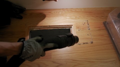 Home Duct Cleaning Services, ventilation cleaner man at work with tool. Slow motion view