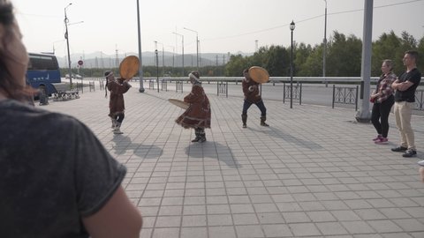 Рetropavlovsk-kamchatsky, Russia - 08 18 2021: Tourists watch the indigenous people of Kamchatka dance and beat the tambourine