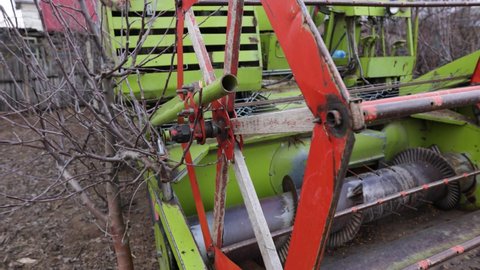 Combine Harvester Reel And Auger At The Farm. - close up