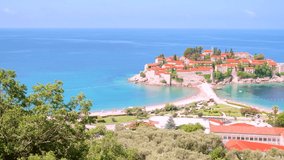 Gorgeous view of the small islet Sveti Stefan. Location place Montenegro, Adriatic sea, Balkans, Europe. European travel destination. Cinematic shot. Filmed UHD 4k video. Discover the beauty of earth.