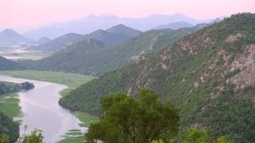 Spectacular footage overlooking the bend of Rijeka Crnojevica. Location place Skadar Lake, Montenegro, Balkans, Europe. Cinematic shot. Filmed in UHD 4k video. Discover the beauty of earth.