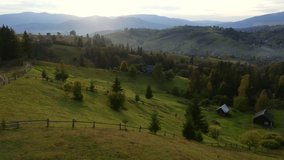 Spring rural landscape in the evening light from a bird's eye view. Location place Carpathian mountains, Ukraine, Europe. Aerial footage, cinematic drone shot. Filmed in UHD 4k video. Beauty of earth.