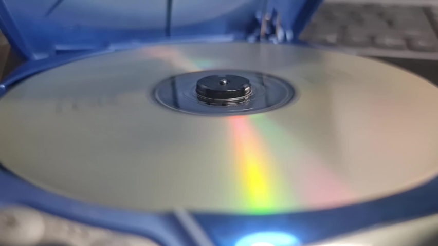 Portable CD Player playing a CD. Spinning cd close up. Royalty-Free Stock Footage #1087190795