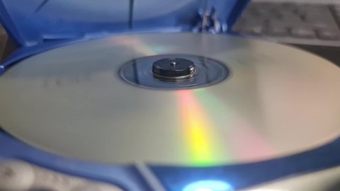 Portable CD Player playing a CD. Spinning cd close up.