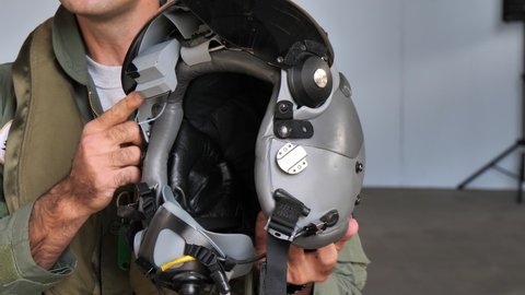 Gando Airport Gran Canaria Spain OCTOBER, 21, 2021 Military pilot explains the helmet he uses when flying modern high performance fighter aircraft