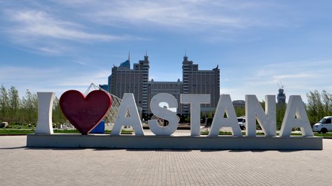 Nur-Sultan Astana MAY, 26, 2018: I love Astana installation. Closeup view. KazMunayGas Oil company in the background. Located in the city of Astana, the capital of Kazakhstan. 