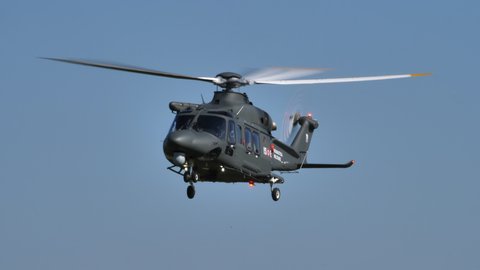 Thiene Italy, OCTOBER, 16, 2021 Modern military search and rescue helicopter takes a bow to greet the audience and flies off at low altitude. Agusta Westland AW139 Leonardo HH139 of Italian Air Force