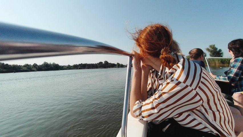 woman enjoying nature view on boat with beautiful sunset on travel at on the river	