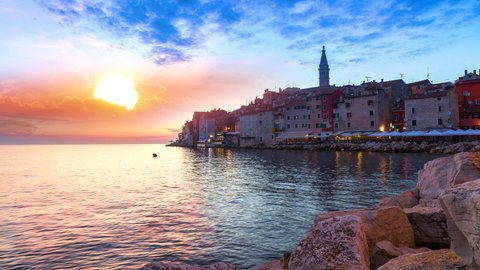 Rovinj croatia old town view skylineat sunset timelapse from day to night, rovigno sea coast view.