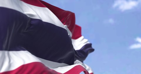 Detail of the national flag of Thailand waving in the wind on a clear day. Democracy and politics. Patriotism. Selective focus. South east Asian country. Seamless slow motion looping