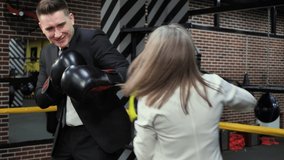 Boss trains his employee in boxing gloves in the ring - Powered by Shutterstock - Get 15% off with code: PIKWIZARD15