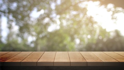 Wood table bar in summer day, and nature background green tree bokeh blurred animated and sun light. (4k3840x2160p29,97fps)