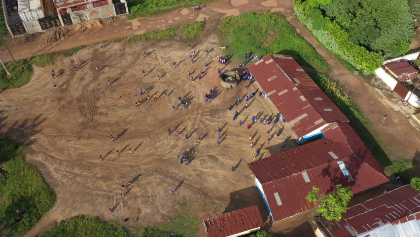 Aerial valley rural village school Sierra Leone fast motion. Sierra Leone on coast of west Africa suffers extreme poverty and hunger. Tropical climate forest, jungle, mountain and savanna landscape. 