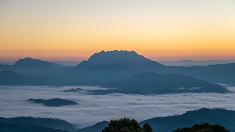 Tropical forest nature landscape with mountain range sunrise time lapse with moving cloud mist at Huai Nam Dang National Park, Chiang Mai Thailand 4K timelapse