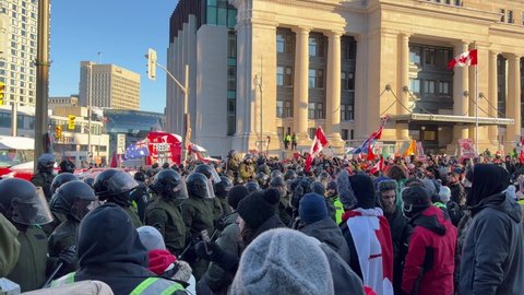 Ottawa, Ontario, Canada - February 18, 2022: Confrontation with police and protesters  - Trucker Freedom Convoy 2022 Ottawa  