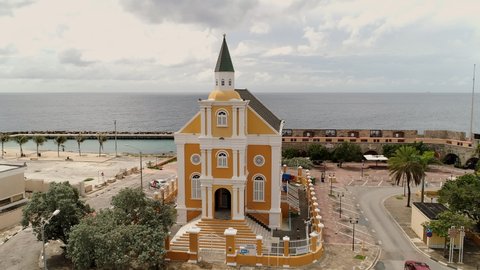church in Willemstad, is the capital city of Curaçao, a Dutch Caribbean island. aerial view features brightly painted colonial buildings and colorful roofs