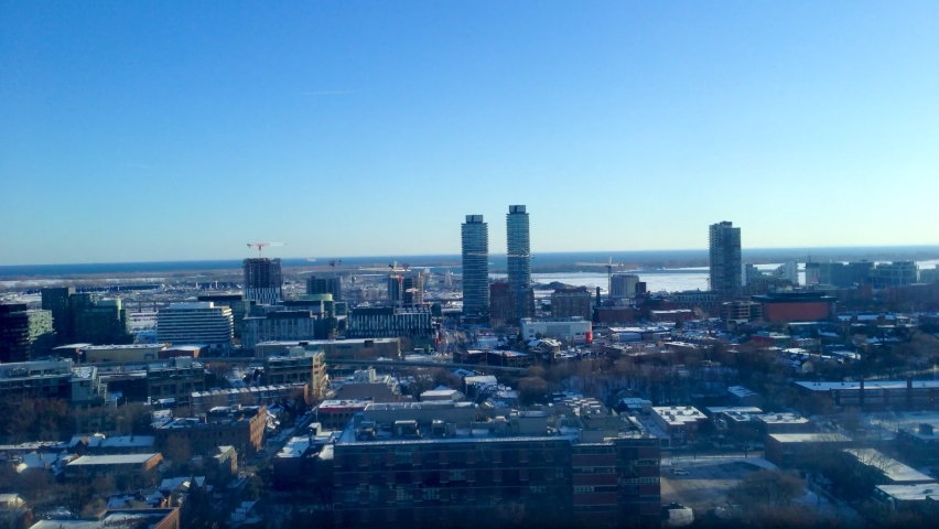 Time lapse from Toronto Regent Park area buildings view from North looking West onto Quayside and Bayside Toronto, Canada area district aerial view towards Lake Ontario fast motion establishing shot