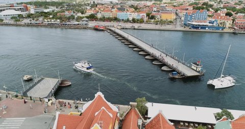 Willemstad bridge boats crossing out to the sea.
