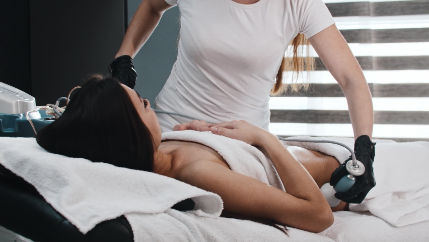 Young woman on electric massage session