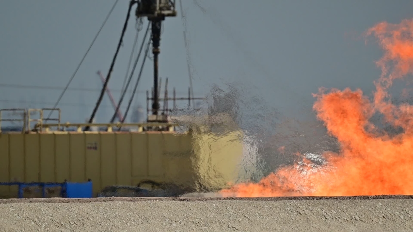Ground Flaring of high pressure dangerous gas from the gas well in the oil field- slow motion fire 
