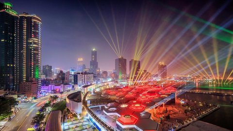 Kaohsiung, Taiwan-2022: Aerial photography of  Kaohsiung City and Kaohsiung Harbor.The night view of light show for Kaohsiung change name one hundred year with music center.