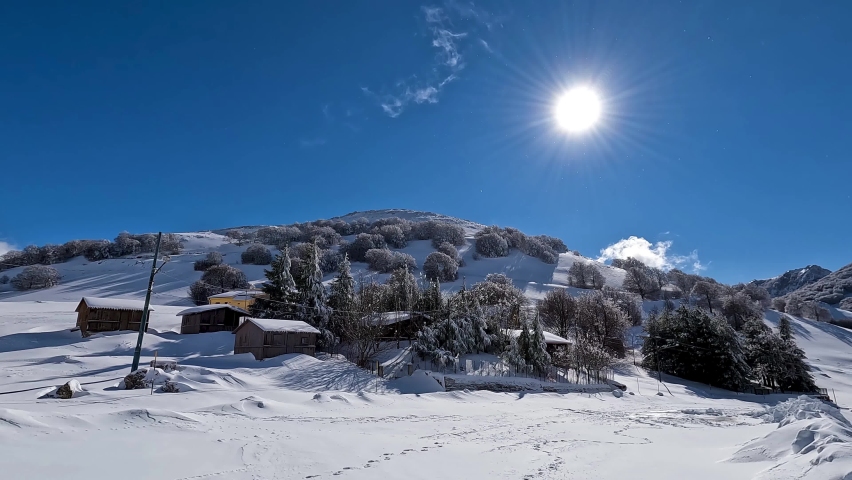 Typical house on the Madonie in winter. Skiing at Piano Battaglia during the winter. Snow in Sicily. Madonie Park. La Mufara with the ski slopes. Winter tourism in Sicily. Snowy forest.