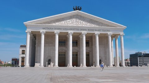 Nur-Sultan Astana MAY, 26, 2018: Astana Opera, state opera and ballet theatre. The largest theatre in Central Asia. Classical style building with golden ornaments, sculptures, columns and pediment.
